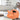 Spardose Sparschwein mit Hammer aus Keramik orangefarben 15x10 cm - Lifestyle & More