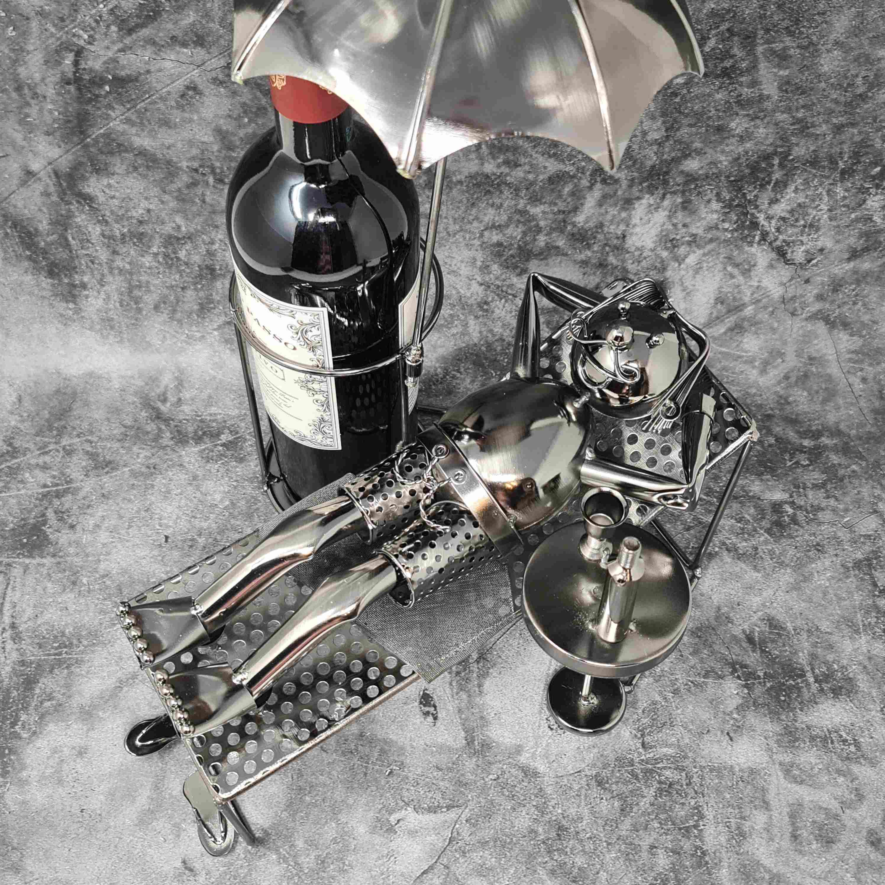 Modern wine bottle holder holidaymaker made of metal in silver height 39 cm length 30 cm