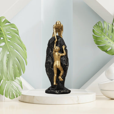 Skulptur Stein mit Menschen "Helfende Hand" aus Kunststein gold und schwarz Höhe 26,5cm Breite 10cm - Lifestyle & More